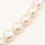 Close-up of near-round 5.5mm freshwater pearls with a clean surface and soft natural luster