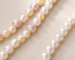 Are freshwater pearls real? Cultured freshwater pearl strands photographed in natural light.