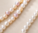 Are freshwater pearls real? Cultured freshwater pearl strands photographed in natural light.