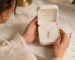 Woman opening a pearl jewelry gift box with a meaningful necklace